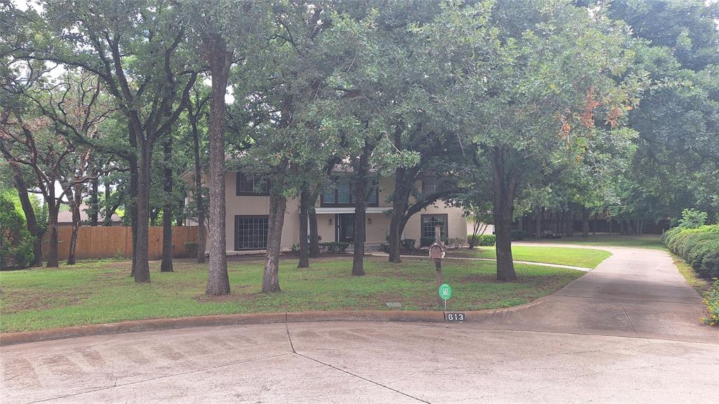 eastern front to this treed, wide culdesac location with long side entry driveway