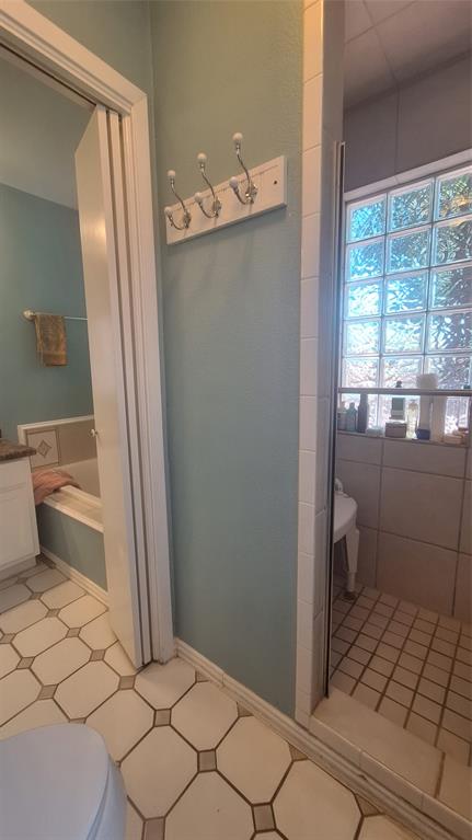 613 Colts Neck Court Colleyville, TX 76034 - Photo 14 of 38 roll in shower with glass block window