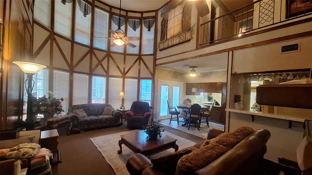 613 Colts Neck Court Colleyville, TX 76034 - Photo 16 of 38 2 story great room view of 2 story bay window great room & north side 2nd floor wing, open breakfast into kitchen and pull up a bar stool to sit at 7x4 wet bar