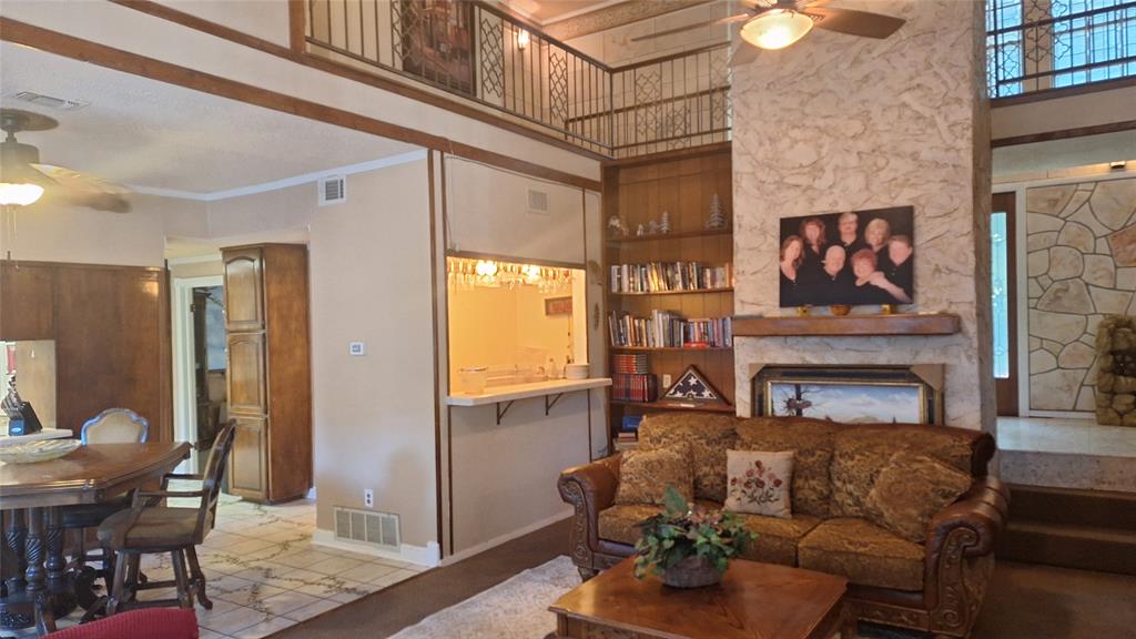 613 Colts Neck Court Colleyville, TX 76034 - Photo 21 of 38 view into front entry hall, 7x4 wet bar. breakfast & kitchen & into front formal dining & upstairs loft