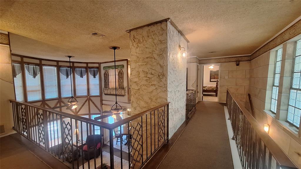 613 Colts Neck Court Colleyville, TX 76034 - Photo 27 of 38 upstairs front loft walkway to north wing room and bathroom