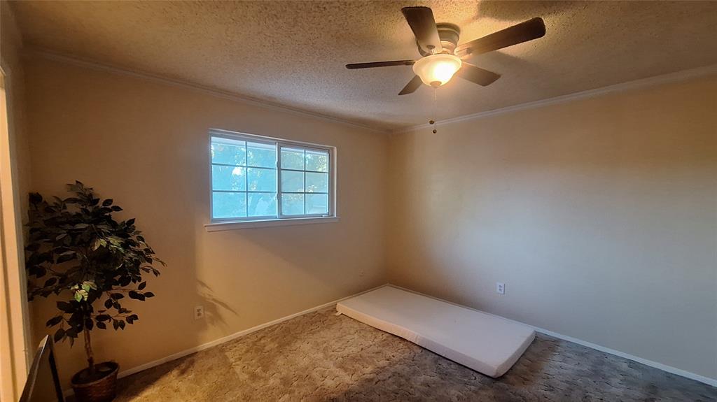 613 Colts Neck Court Colleyville, TX 76034 - Photo 30 of 38 upstairs north side rear BR3 2nd MBR views back yard, WI closet & snsuite bath