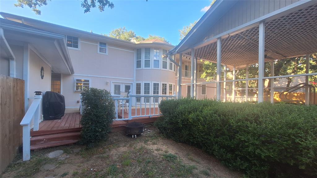 613 Colts Neck Court Colleyville, TX 76034 - Photo 3 of 38 wood privacy enclosed backyard with 2 gates to front driveway and front side yard, ample greenspace on both sides of cabana for pool & kids swing set and trampoline