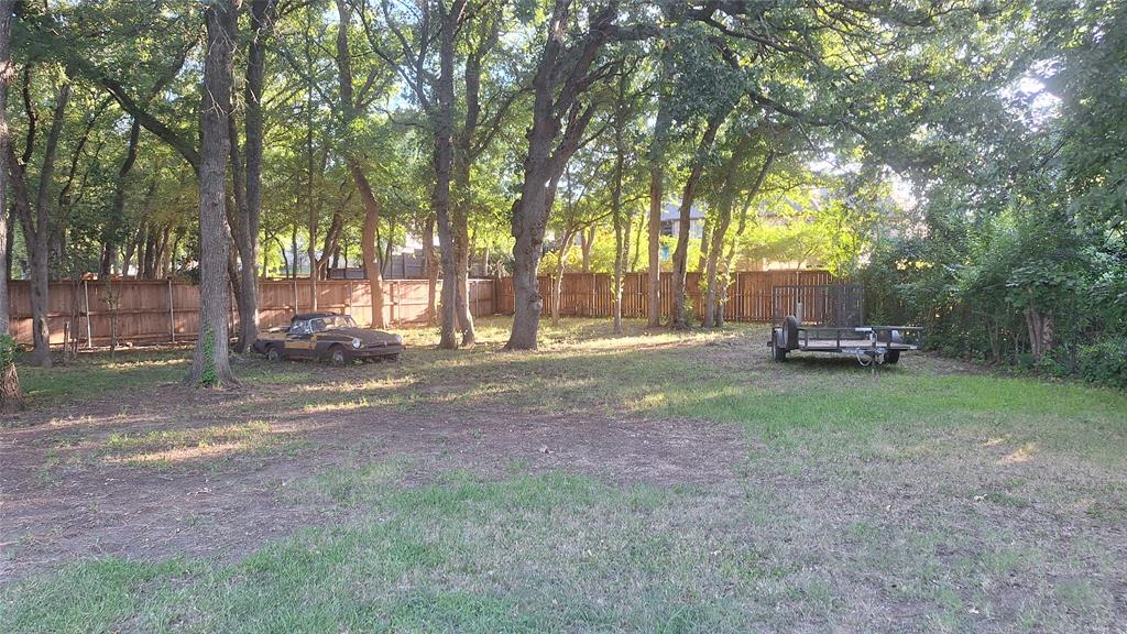 613 Colts Neck Court Colleyville, TX 76034 - Photo 4 of 38 wood privacy enclosed backyard with 2 gates to front driveway and front side yard, ample greenspace on both sides of cabana for pool & kids swing set and trampoline