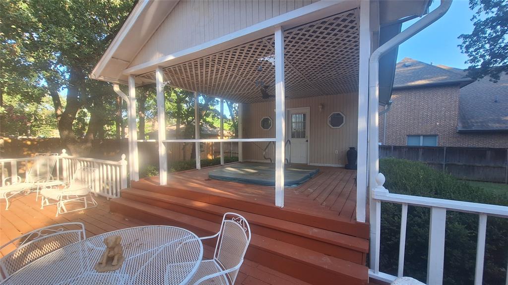 613 Colts Neck Court Colleyville, TX 76034 - Photo 6 of 38 raised covered deck with entrance to 16x4 cabana with bathroom shower and dressing space.