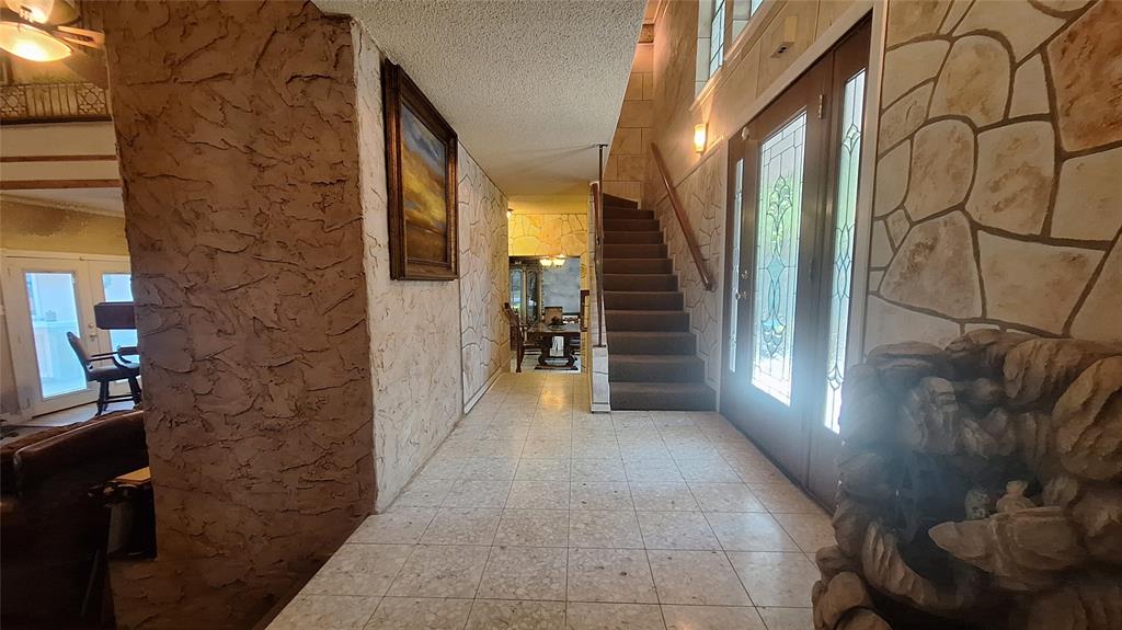 613 Colts Neck Court Colleyville, TX 76034 - Photo 8 of 38 gorgeous custom glass front door entrance into spacious entry hall with split front dining and den or offfice