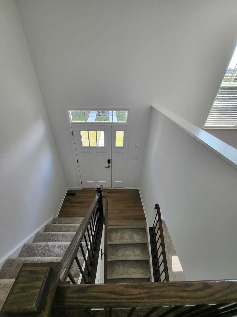 588 Wolverine Drive Aurora, IL 60502 - Photo 4 of 29 a view of entryway and hall with wooden floor