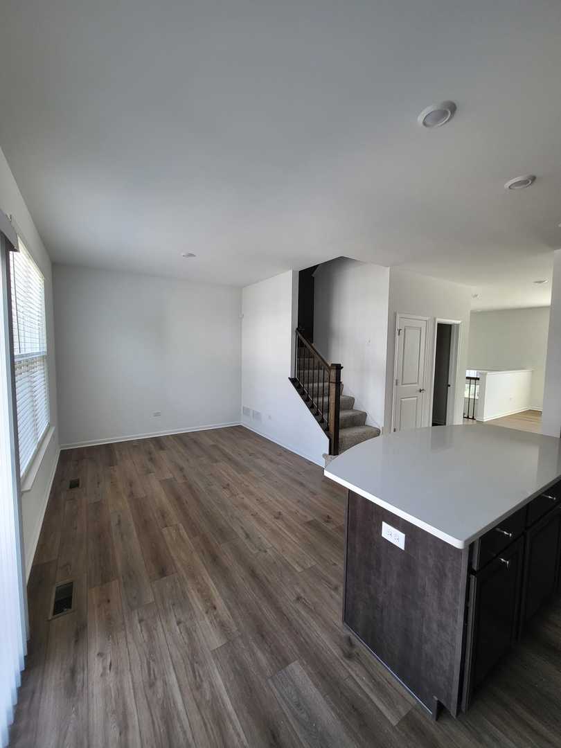 588 Wolverine Drive Aurora, IL 60502 - Photo 10 of 29 a room with wooden floor and breakfast area