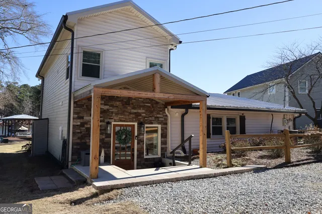 a front view of a house with garden