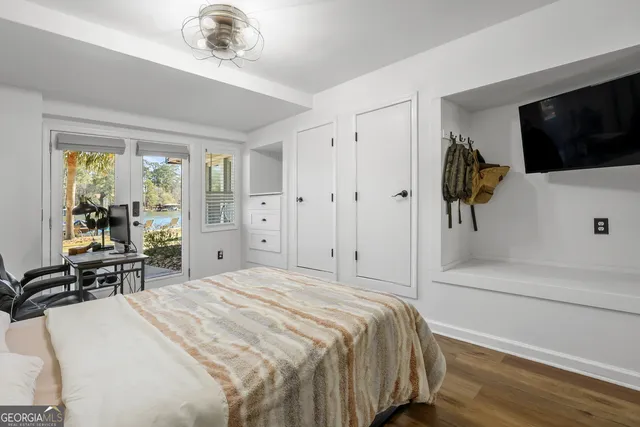 a white toilet sitting next to a bathroom shower