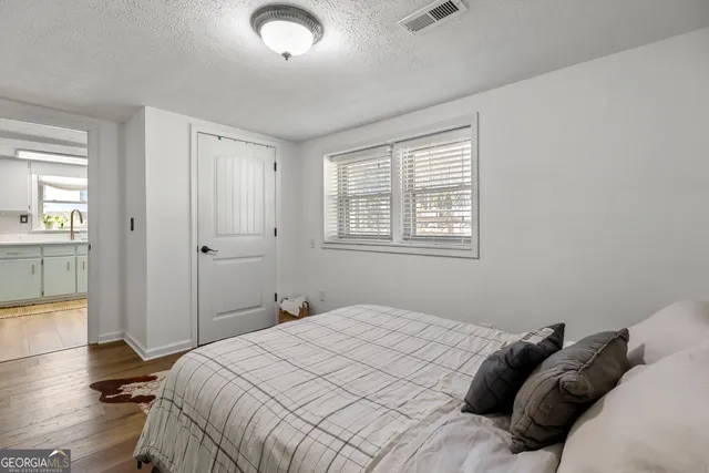 a bathroom with a shower and a sink