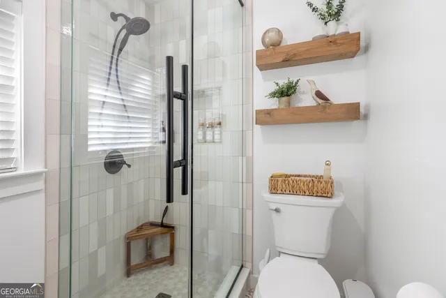 a view of a lake with boats and trees in the background
