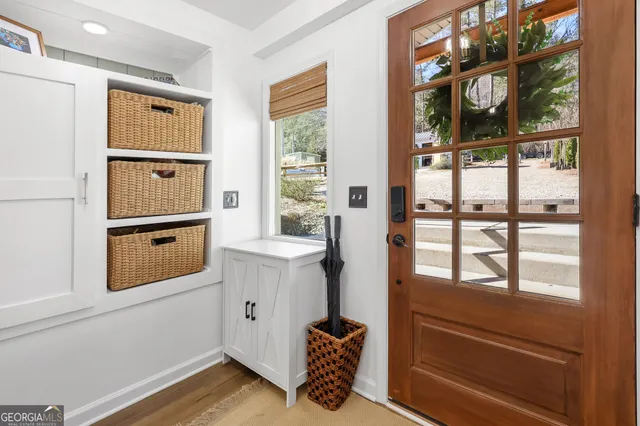 a living room with furniture and a book shelf