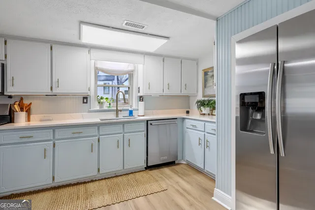 a living room with furniture ceiling fan and a rug