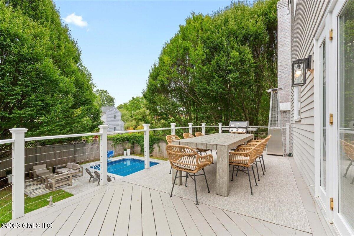 5 Sunshine Avenue Riverside, CT 06878 - Photo 16 of 35 a roof deck with table and chairs and wooden floor