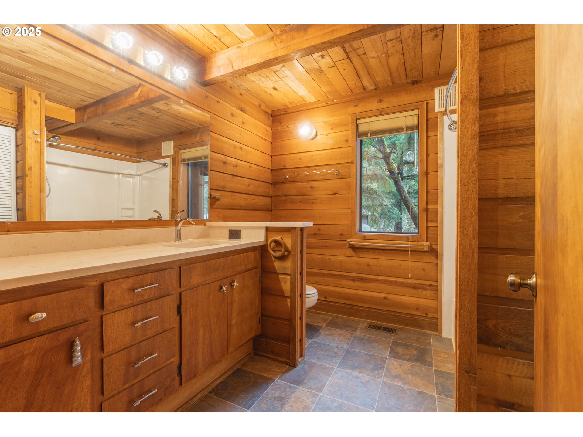 3054 Hendricks Hill Drive Eugene, OR 97403 - Photo 5 of 25 a bathroom with a sink and a mirror