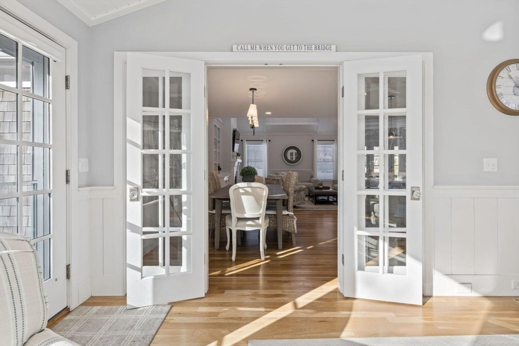 21 Hunter Rise Chatham, MA 02633 - Photo 14 of 37 a view of a hallway with wooden floor and windows