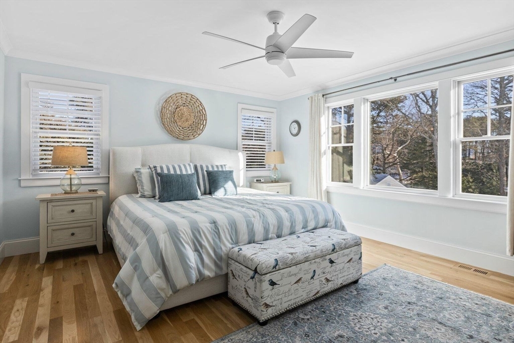 21 Hunter Rise Chatham, MA 02633 - Photo 21 of 37 a bedroom with a large bed and a window