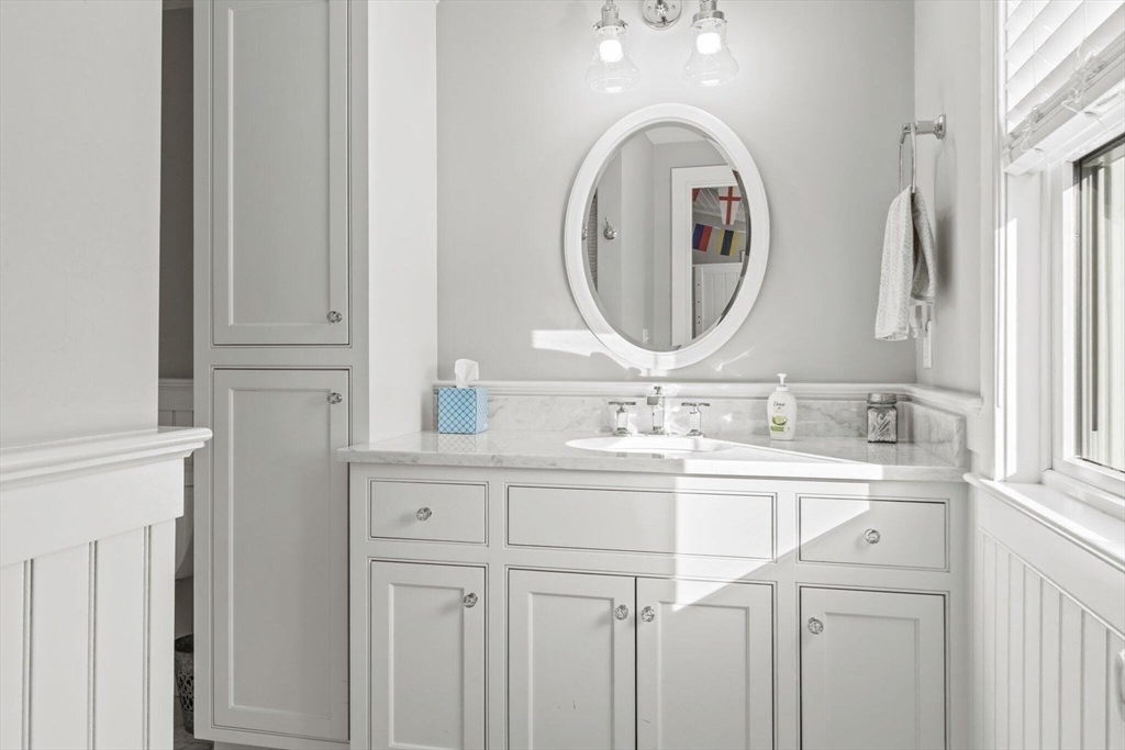 21 Hunter Rise Chatham, MA 02633 - Photo 23 of 37 a bathroom with a double vanity sink and a mirror