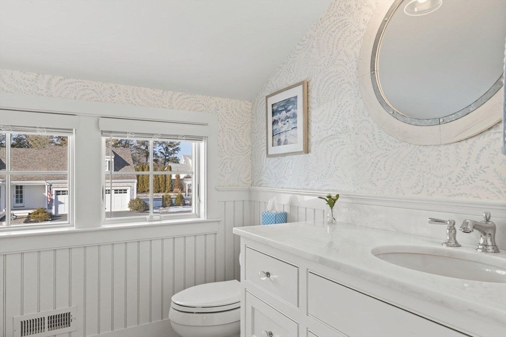 21 Hunter Rise Chatham, MA 02633 - Photo 26 of 37 a bathroom with a granite countertop toilet a sink and a mirror