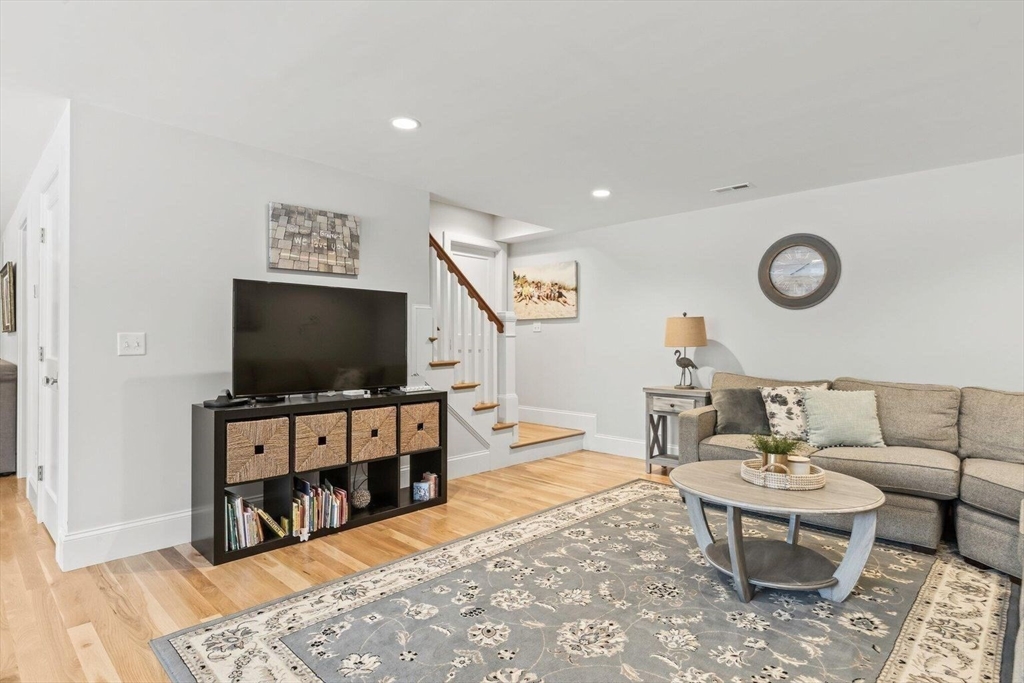 21 Hunter Rise Chatham, MA 02633 - Photo 27 of 37 a living room with furniture and a flat screen tv