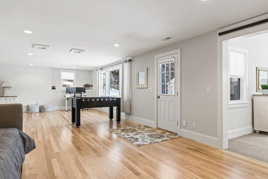 21 Hunter Rise Chatham, MA 02633 - Photo 29 of 37 a living room with furniture and a wooden floor