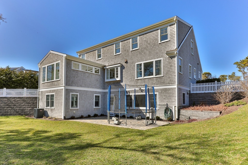 21 Hunter Rise Chatham, MA 02633 - Photo 31 of 37 a front view of house with yard and swimming pool
