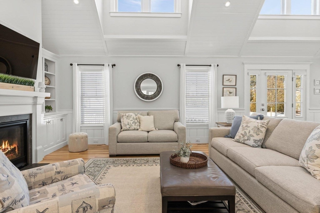 21 Hunter Rise Chatham, MA 02633 - Photo 5 of 37 a living room with furniture a fireplace and a flat screen tv