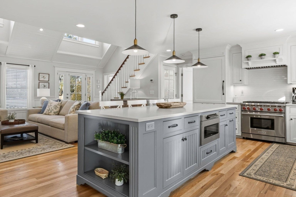 21 Hunter Rise Chatham, MA 02633 - Photo 10 of 37 a kitchen with stainless steel appliances granite countertop a stove a sink and a living room view