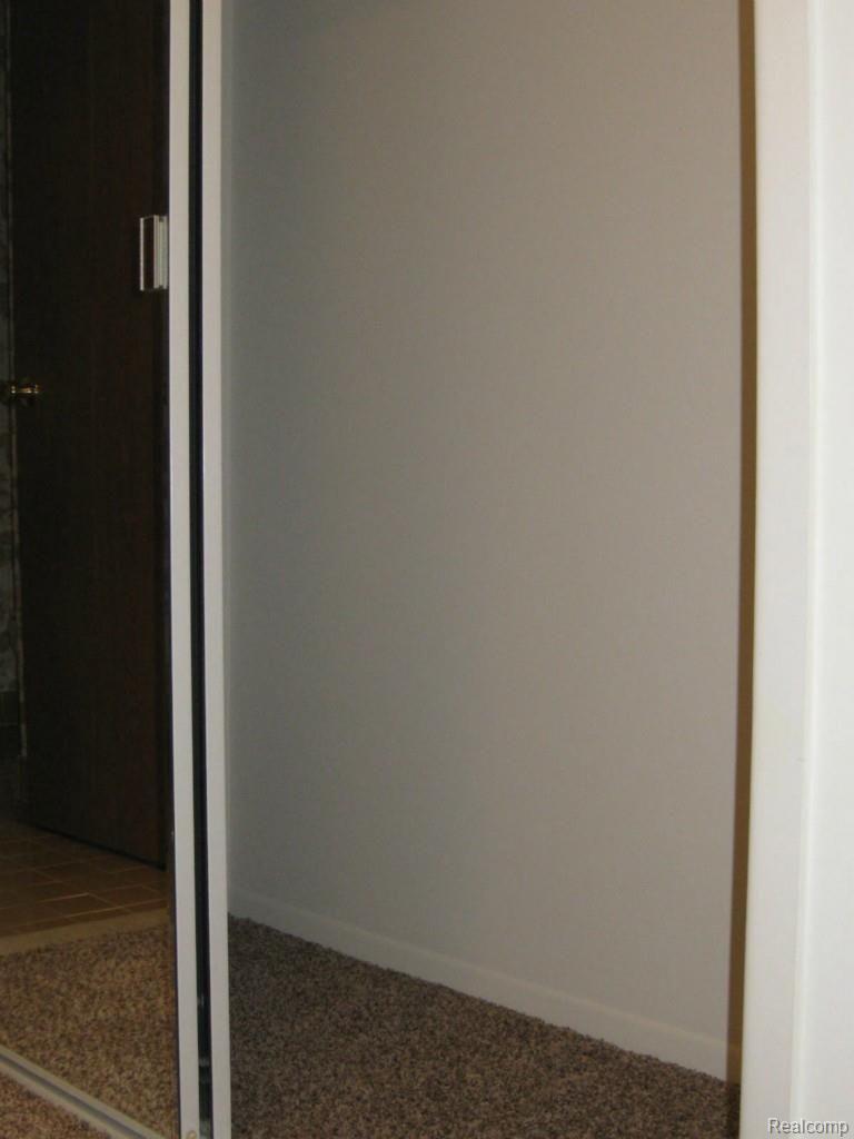 519 Tennyson, Unit 23 Rochester, MI 48307 - Photo 23 of 33 Carpeted closet floors.jpg