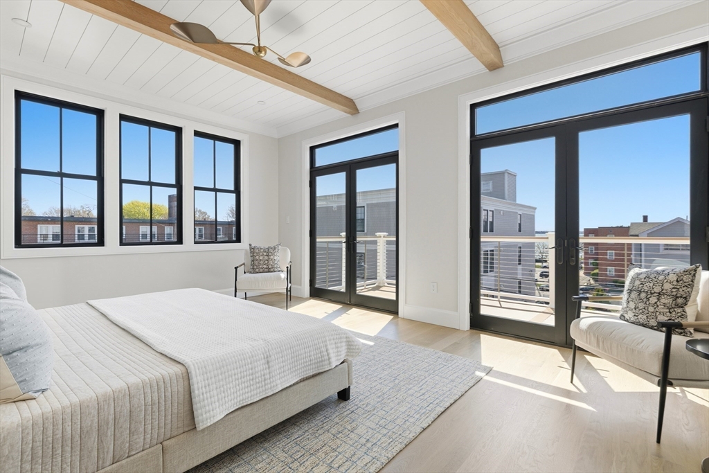 847 East 5th Street, Unit 2 Boston, MA 02127 - Photo 17 of 24 a bedroom with a large bed and a large window