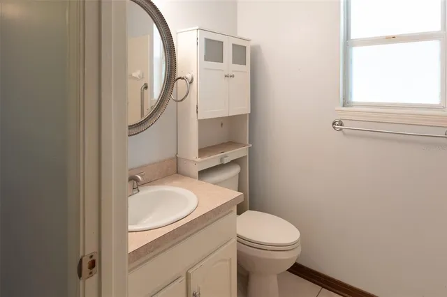 a white bath tub sitting next to a window