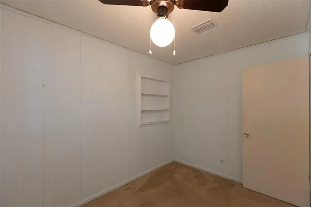 a view of hallway with windows