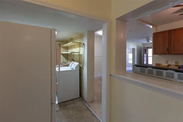 a room with storage and utility room in background