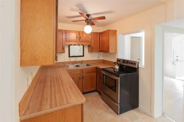 a kitchen with a stove and a sink