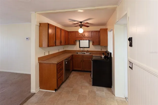 a kitchen with a refrigerator sink and stove