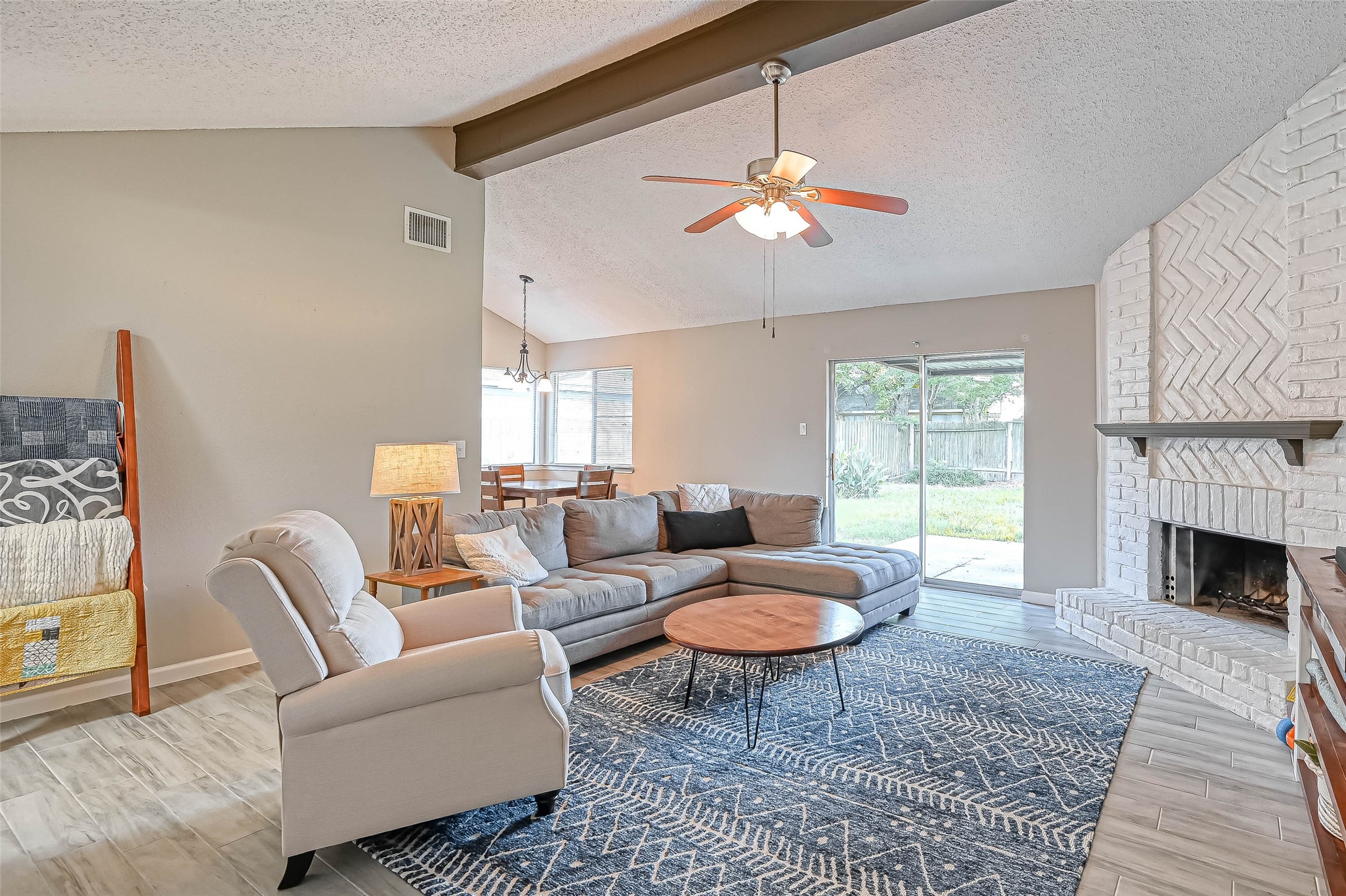 22622 John Rolfe Lane Katy, TX 77449 - Photo 6 of 21 a living room with furniture a fireplace and a table