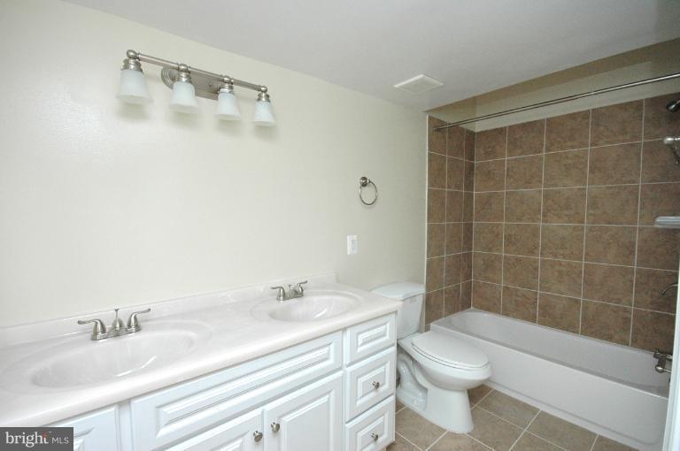 804 Rittenhouse Street Northwest Washington, DC 20011 - Photo 14 of 30 a bathroom with a sink a toilet and shower