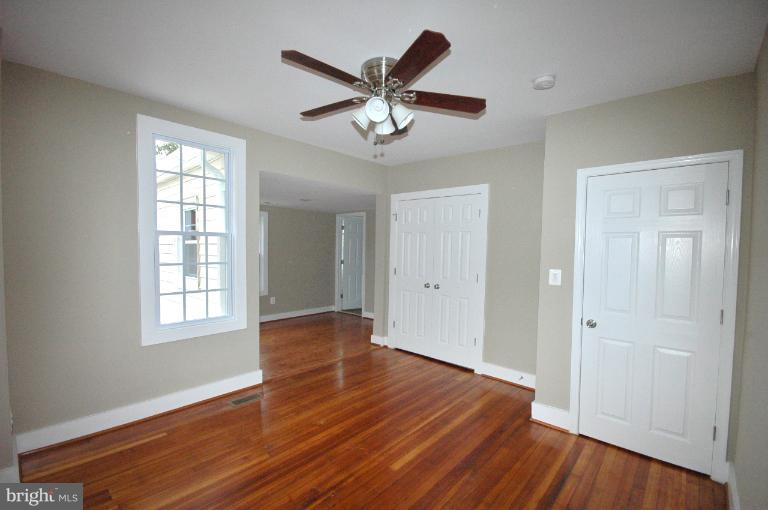804 Rittenhouse Street Northwest Washington, DC 20011 - Photo 4 of 30 a view of an empty room with wooden floor and a window