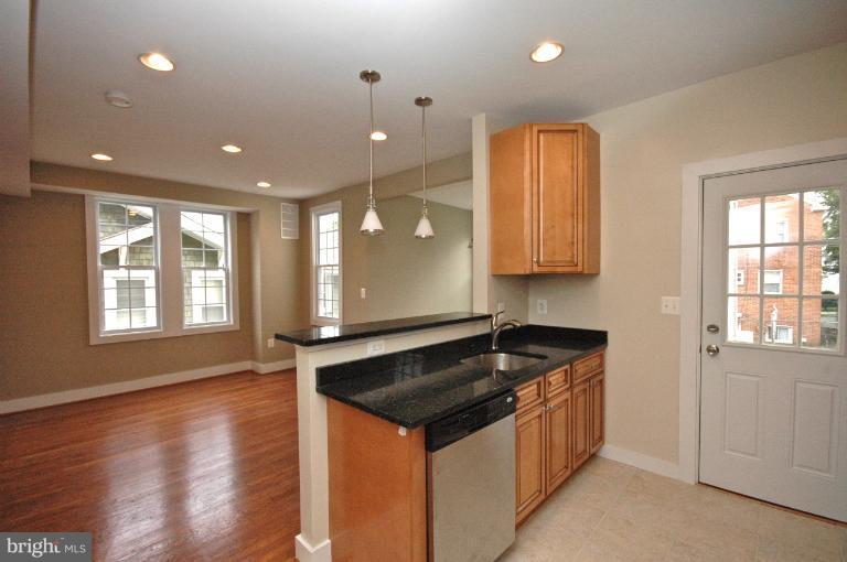804 Rittenhouse Street Northwest Washington, DC 20011 - Photo 9 of 30 a kitchen that has a sink a stove and wooden floor