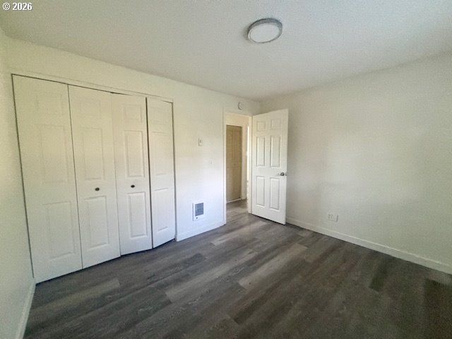 1940 Willow Street Florence, OR 97439 - Photo 12 of 18 a view of an empty room and wooden floor