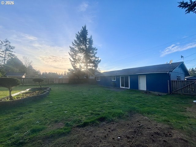 1940 Willow Street Florence, OR 97439 - Photo 18 of 18 a view of a big yard with plants and large trees