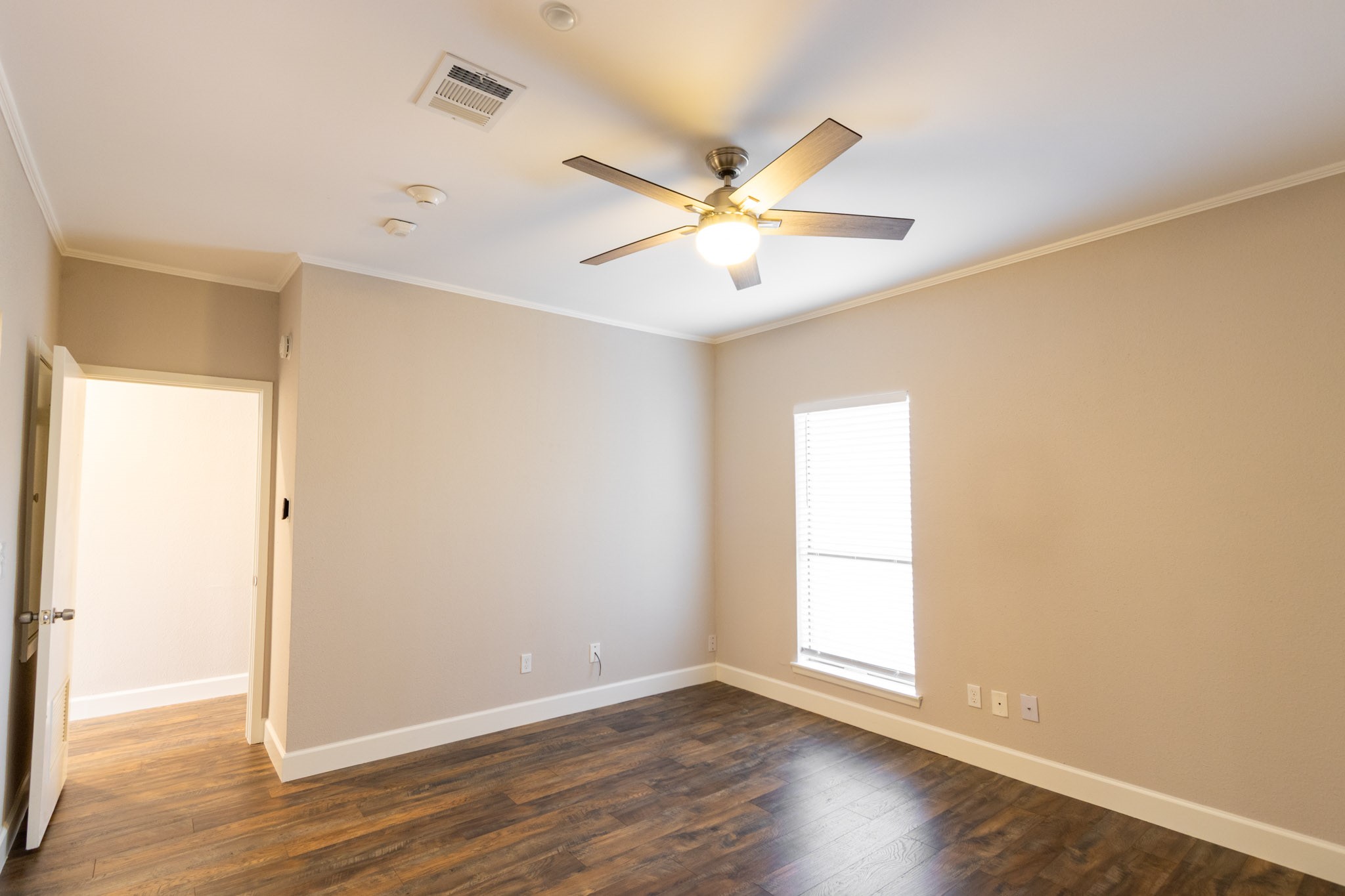401 Lakeside Lane, Unit 111 Nassau Bay, TX 77058 - Photo 18 of 45 a view of an empty room with wooden floor and a window