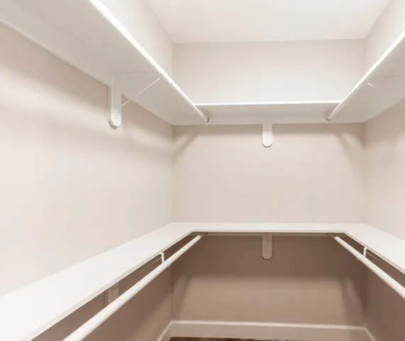 an aerial view of ocean and residential houses with outdoor space