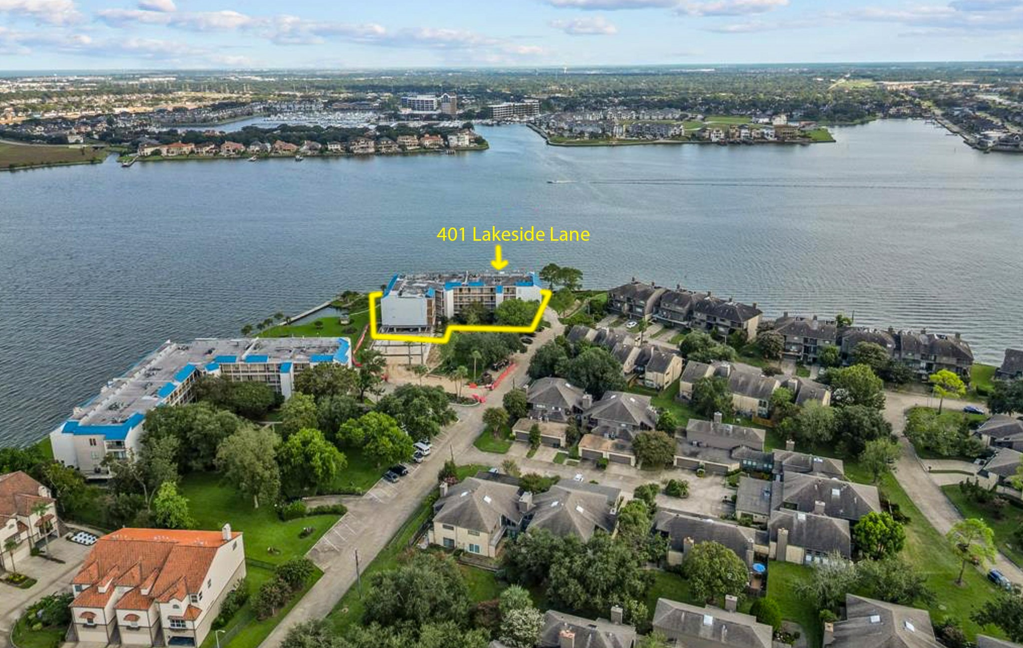 401 Lakeside Lane, Unit 111 Nassau Bay, TX 77058 - Photo 3 of 45 an aerial view of ocean and residential houses with outdoor space