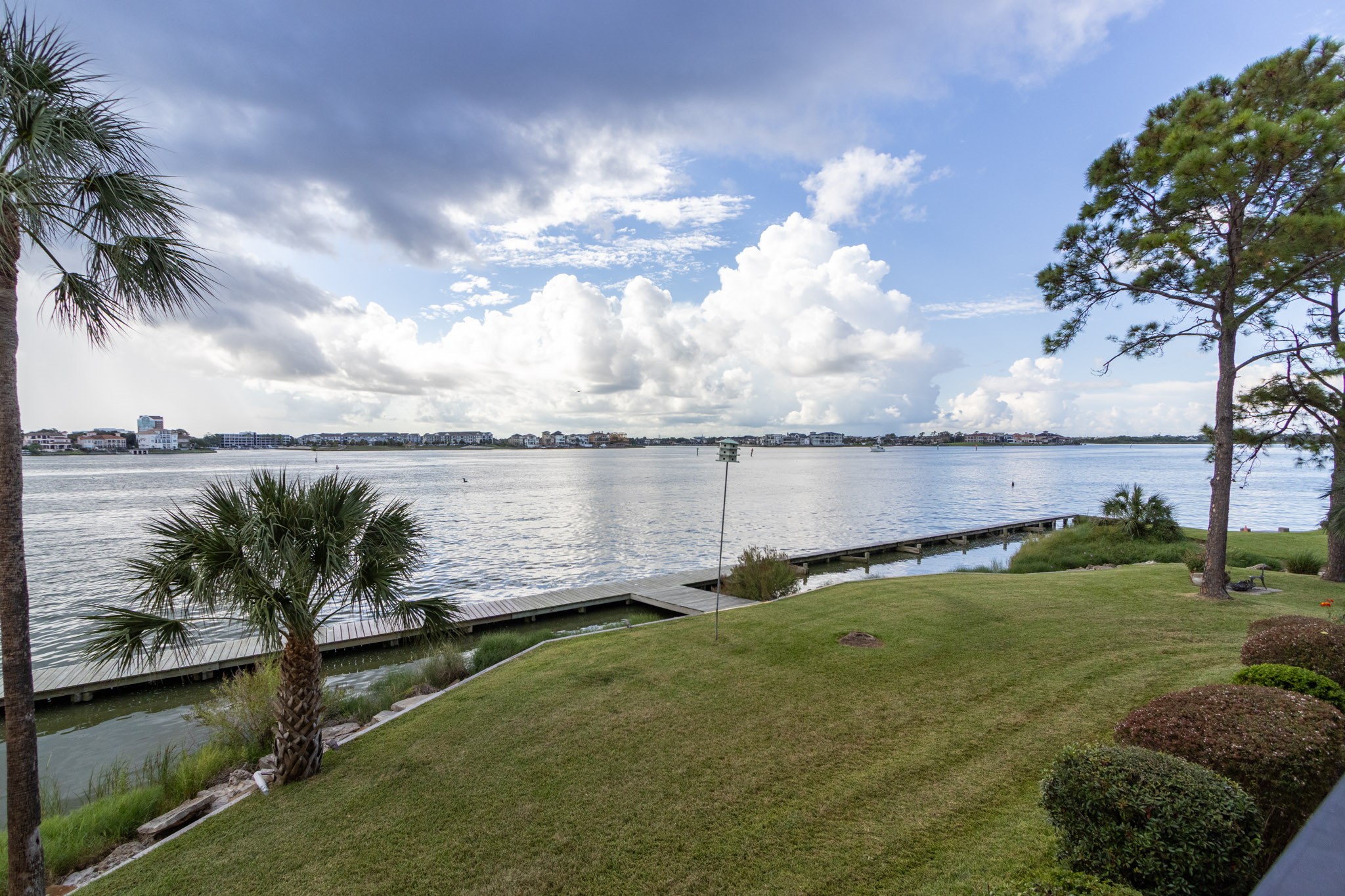 401 Lakeside Lane, Unit 111 Nassau Bay, TX 77058 - Photo 33 of 45 a view of a lake with a big yard