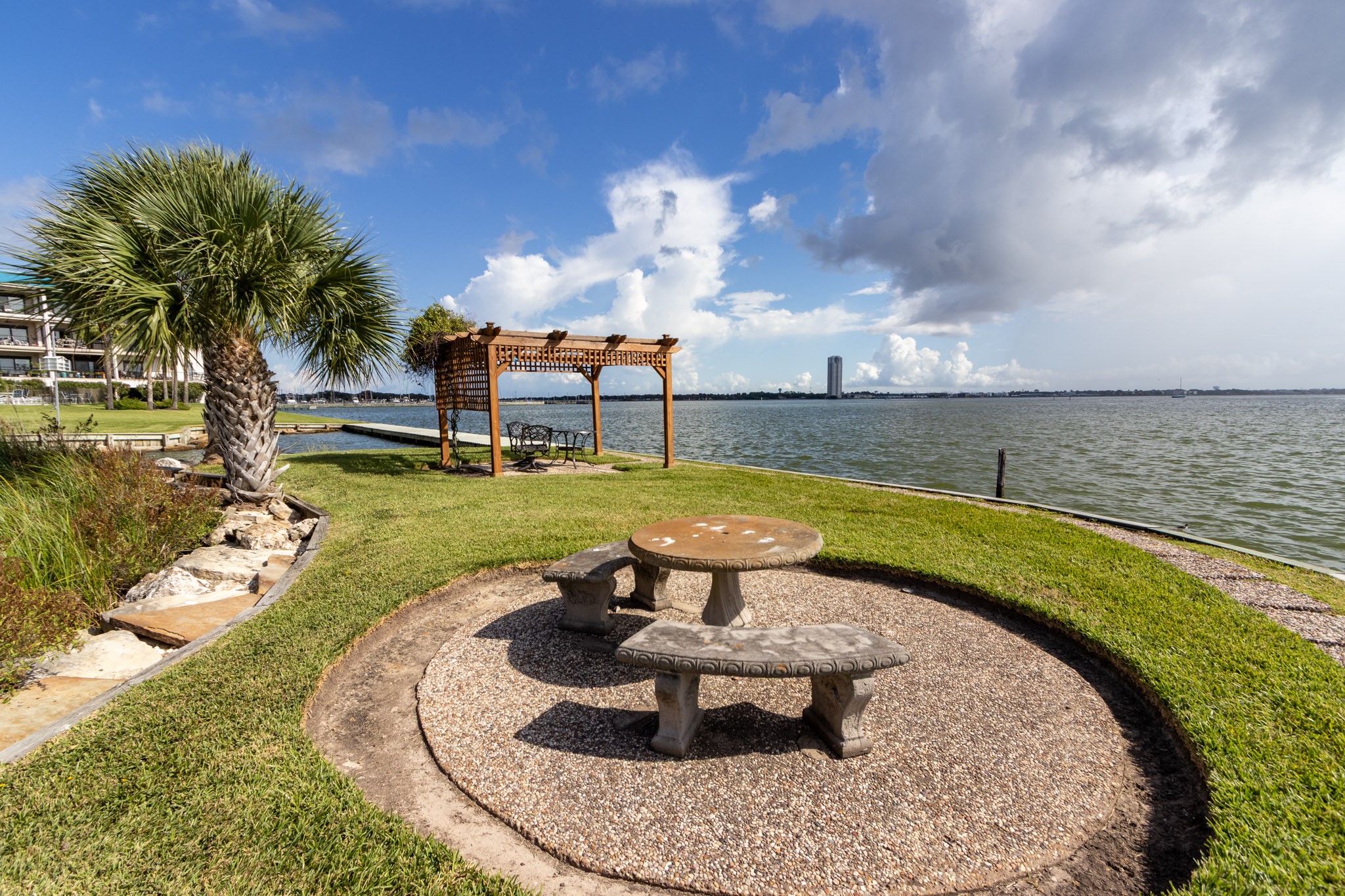 401 Lakeside Lane, Unit 111 Nassau Bay, TX 77058 - Photo 40 of 45 a view of a swimming pool with a patio