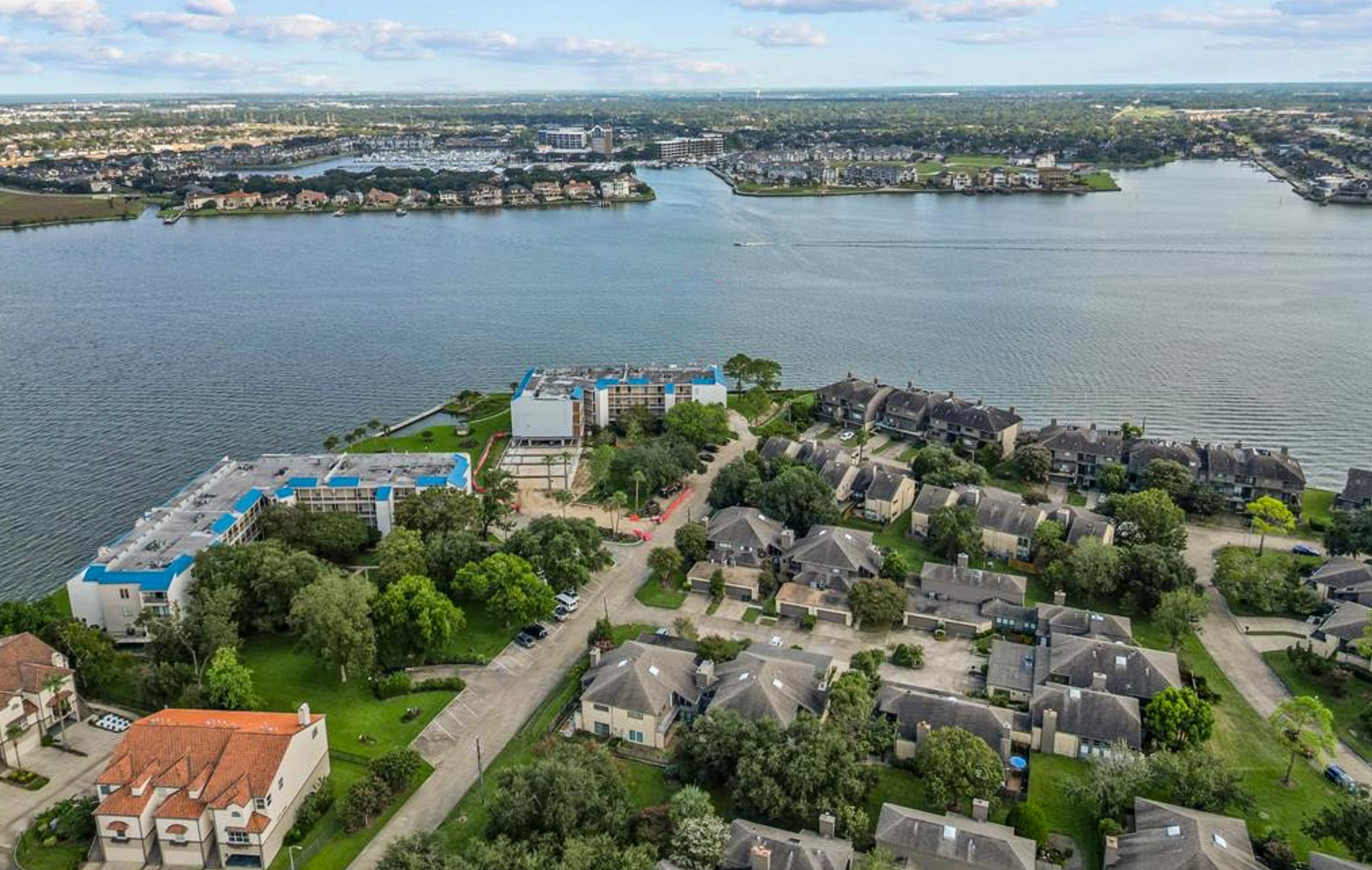 401 Lakeside Lane, Unit 111 Nassau Bay, TX 77058 - Photo 44 of 45 an aerial view of ocean and residential houses with outdoor space