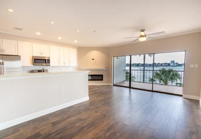 a stove top oven sitting inside of a kitchen
