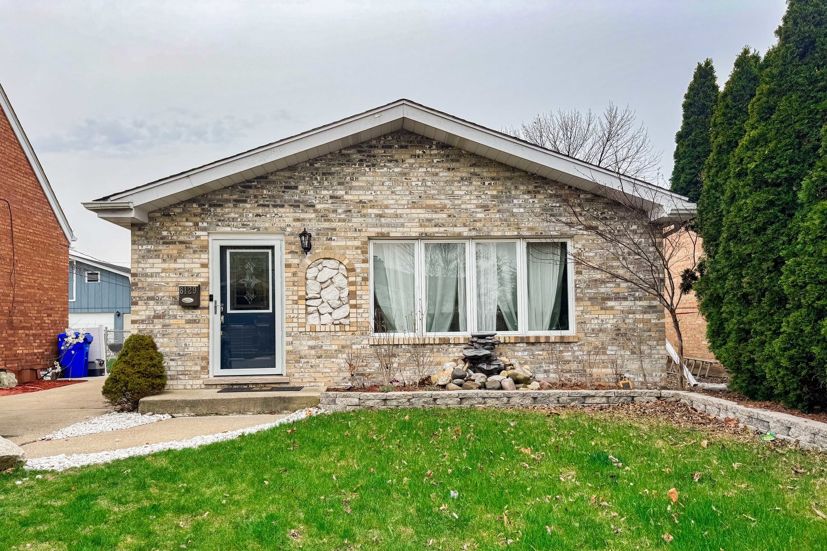8129 45th Place Lyons, IL 60534 - Photo 1 of 45 a front view of a house with a yard